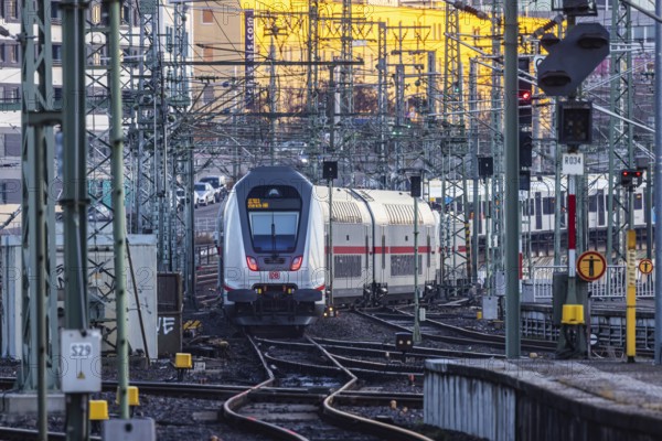 InterCity IC to Zurich leaving Stuttgart Central Station in the morning. Rail signals and overhead