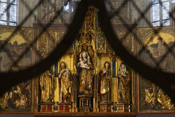 Mother of God on the crescent moon with baby Jesus, elevated on a pedestal, left and right John the