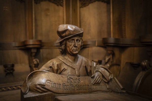 Carved half-figure, man with headdress, oak choir stalls for monks' hour prayers, 1493 by Jörg