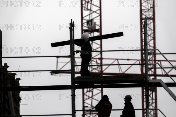 Construction site, scaffolding work on a large construction project, apartments and commercial