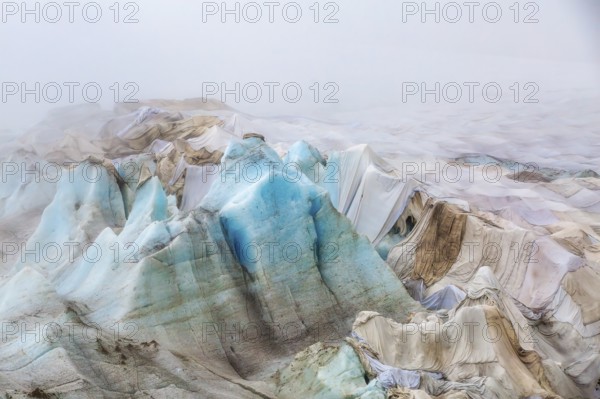 Rhone Glacier covered to protect it from melting, highlighting climate change and global warming,