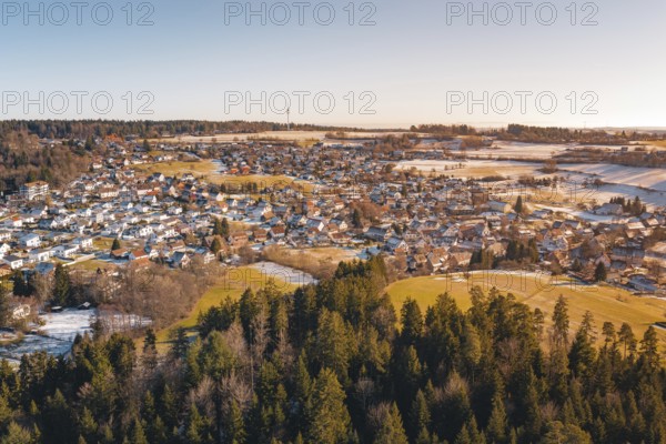 Snowy village landscape with adjacent forest and soft colors, Hallwangen, Freudenstadt district,