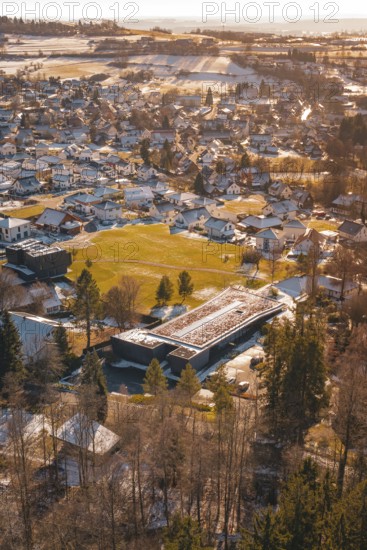Small town with snow-covered roofs and trees from a bird's eye view, Hallwangen, Freudenstadt