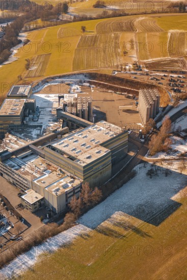 Industrial site in wintry snowy fields and simple countryside, Hallwangen, Freudenstadt district,