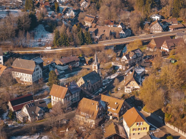 Village in winter with a distinctive church and surrounding snow-covered houses, Aach, Dornstetten,