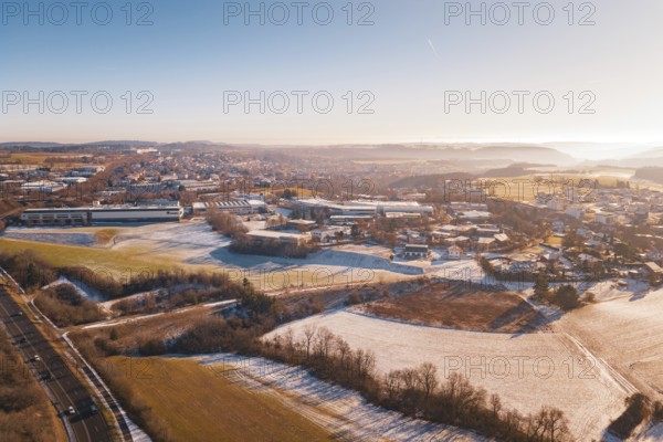 Winter landscape with fields and town houses in soft morning light, Dornstetten, Freudenstadt
