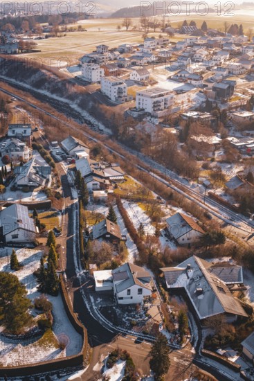 Snowy urban landscape with railway line and scattered houses, Dornstetten, Freudenstadt district,