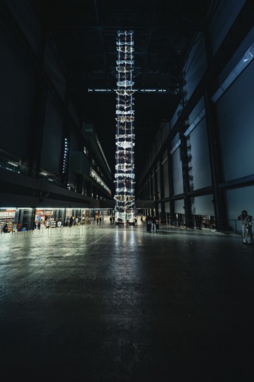 High room with luminous installation, dark industrial atmosphere, Tate Modern of Art, Lodon, United