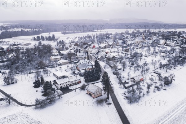 Snowy village in a wintry landscape, surrounded by trees and fields, Wiesenstetten, Freudenstadt