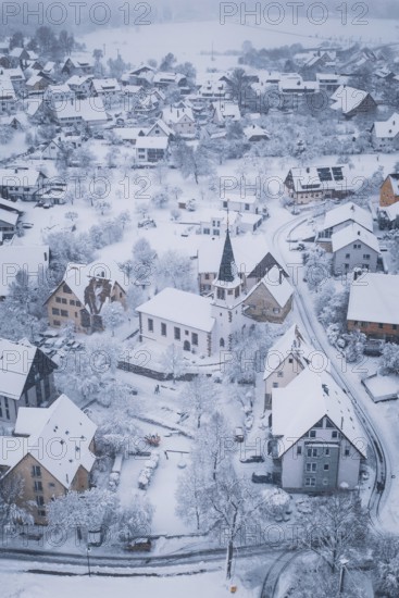 Winter landscape of a village with church and snowy roads, Schopfloch, Freudenstadt district,