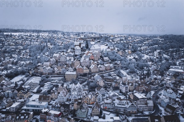 Snowy urban view with densely packed houses and winter views, Altensteig, Calw district, Germany