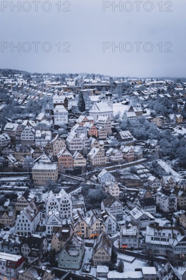 Snow-covered town with numerous half-timbered houses and a distinctive church, Altensteig, Calw