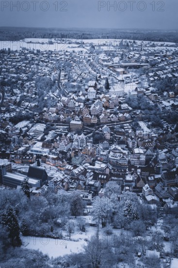 Far-reaching view of a snowy urban landscape with church and houses, Altensteig, Calw district,