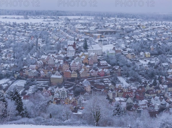 Snowy city landscape with colorful half-timbered houses and winter flair, Altensteig, Calw