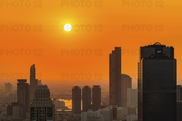 Over the rooftops of Bangkok, sunset, view from the Moon Bar on the roof terrace of the Banyan Tree