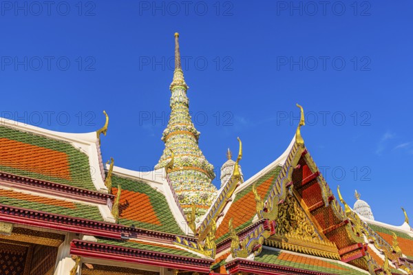 The Grand Royal Palace, Wat Phra Kaeo Buddhist Temple, overlapping roofs with curved chofas, Chedi