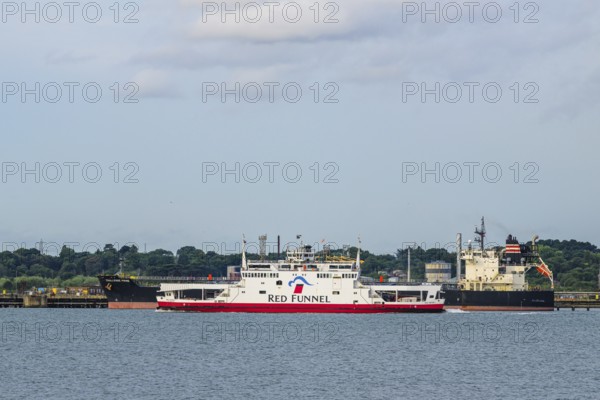 Red Funnel Ferry over refinery Esso Oil Terminal, Southampton, Hampshire, England, United Kingdom