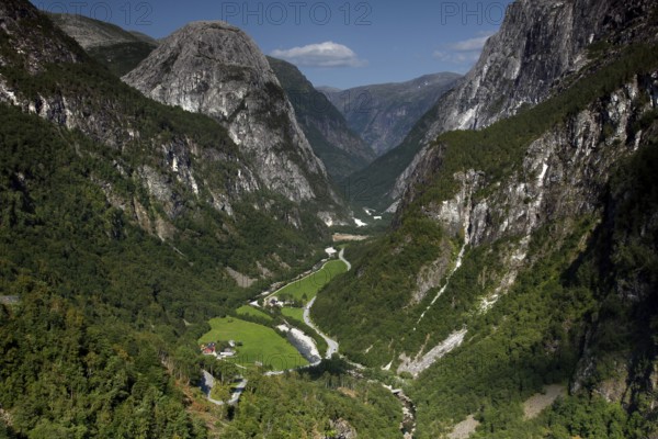 Breathtaking view of the Nærøy Valley with green valley floor and steep rock walls, Stalheim,