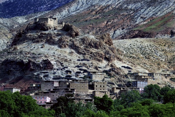 Village in rocky surroundings of the High Atlas with traditional houses and impressive landscape,
