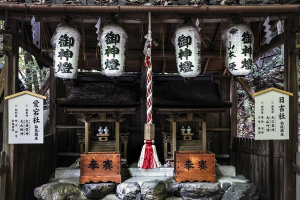 Otoyo-jinja shrine with symmetrically arranged lanterns and decorated altar on Philosophenweg,