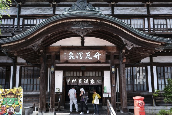 Traditional architecture of Takegawara Onsen with decorated entrance, Beppu, Japan