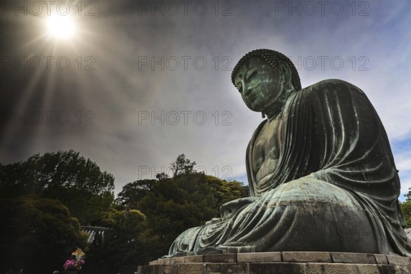 The bronze Big Buddha in Kotokuin Temple with dramatic sunlight in Kamakura, Kamakura, Kanagawa,