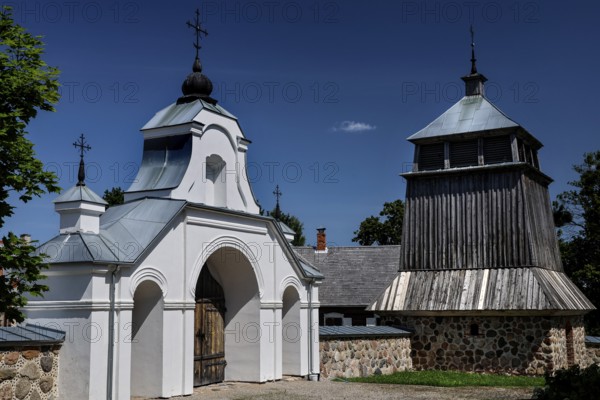 Church with wooden bell tower and gate in the open-air museum, Rumsiskes, Kauno apskritis,