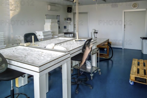 Interior view of the anana salt flats laboratory showing tables with natural salt drying process,