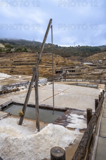 Ancient terraced salt pans extracting salt from brine, showcasing a traditional and historical