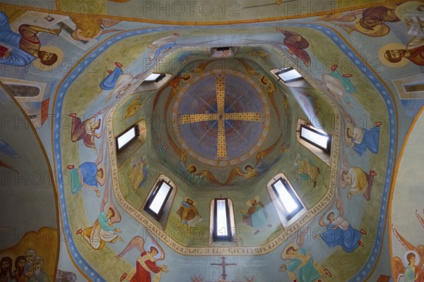 Detailed frescoes in the dome of a church depicting angels and religious figures, domed church by