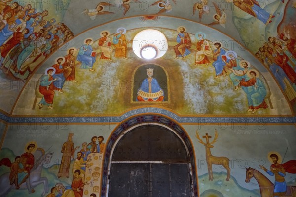 Church interior with detailed wall paintings of saints and biblical scenes, domed church by Kvemo