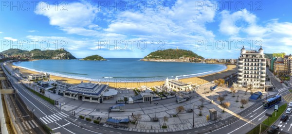 Panoramic view of la concha bay in san sebastian, spain, featuring the sandy beach, city