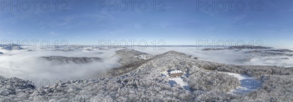 Aerial view of snowy stone walls with shelter and fog in the valley, Schwarzensee, Weissenbach an