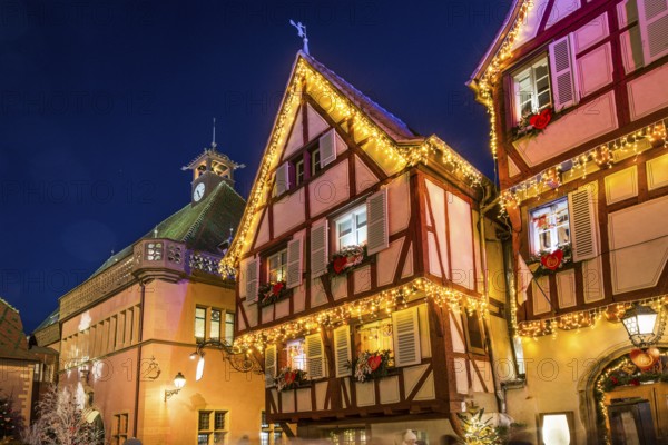 Colourfully illuminated and Christmassy decorated half-timbered houses, old town, blue hour,