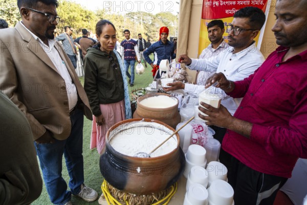 Vendor selling curd and cream dairy product at a stall in Bhogali Mela, ahead of the 'Magh Bihu'