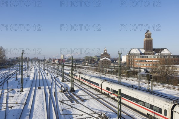 An ICE runs on the railway line next to the BEHALA (Berliner Hafen- und Lagerhausgesellschaft) on