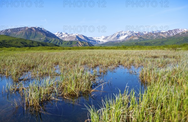 Lake and picturesque mountain landscape with Gulkana glacier and summit Icefall Peak, Richardson