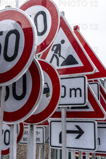 Storage for traffic signs in the yard of a road maintenance department, various signs with