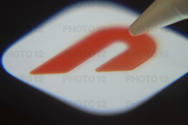 Dhaka, Bangladesh- 06 Dec 2025: Close-up of the DoorDash app on a screen with a stylus pointing at