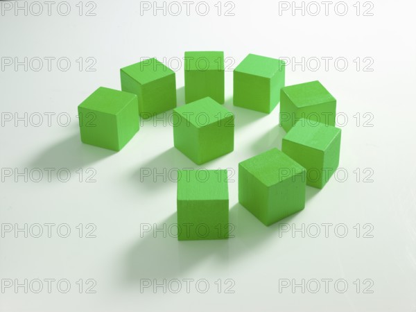 9 green wooden cubes against a white background