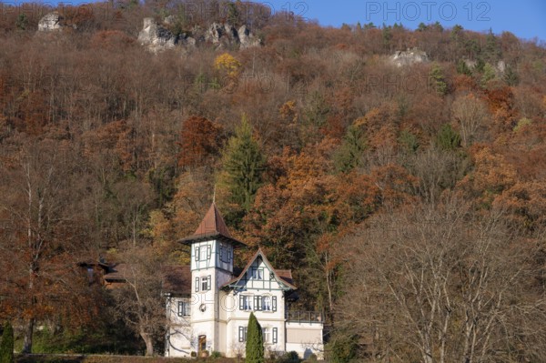 Historic villa in mixed autumn forest in Franconian Switzerland, Muggendorf, Upper Franconia,