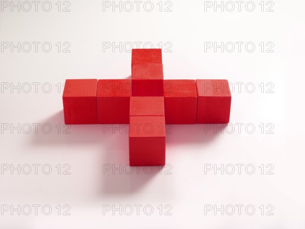 8 red wooden cubes against a white background