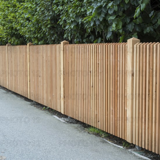 Wooden fence on the side of the road, vertical slats, town of Tegernsee, Upper Bavaria, Bavaria,