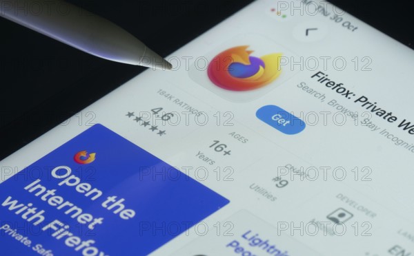 Dhaka, Bangladesh- 30 Oct 2025: Firefox app on a iPad screen with a pen pointing at the install