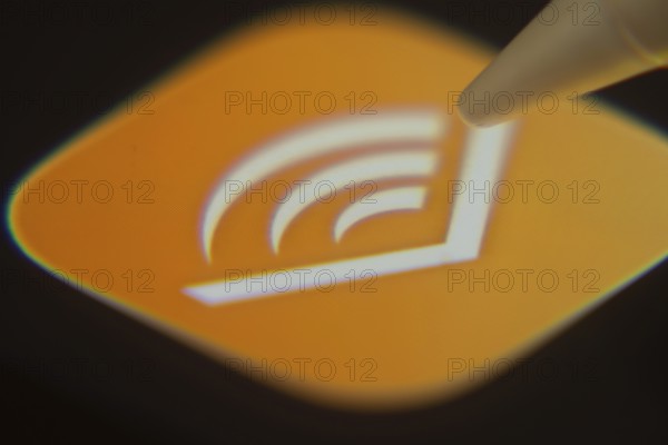 Dhaka, Bangladesh- 06 Dec 2025: Close-up of the Audible app on a screen with a stylus pointing at
