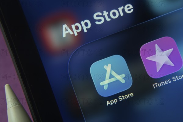 16 Nov 2025- Dhaka, Bangladesh: Close-up of Apple App Store and iTunes Store app icons on a iPad