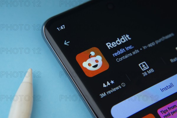 Dhaka, Bangladesh- 09 Mar 2025: Reddit app from Google Playstore is displayed on a smartphone