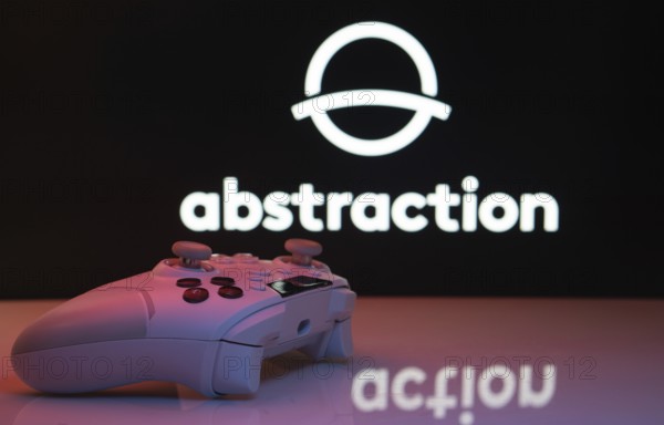Dhaka, Bangladesh- 20 Mar 2025: A close-up of a white gamepad with the Abstraction seen on screen