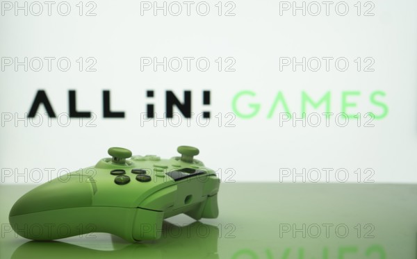 Dhaka, Bangladesh- 20 Mar 2025: A close-up of a white gamepad with the All in! Games seen on screen