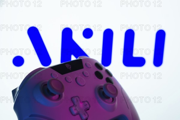 Dhaka, Bangladesh- 20 Mar 2025: A close-up of a gamepad with the Akili Interactive seen on screen